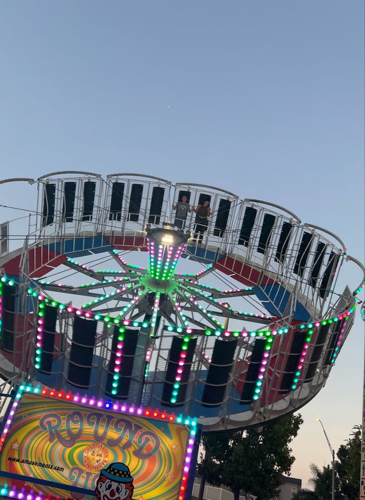 an amusement park ride with lights on it