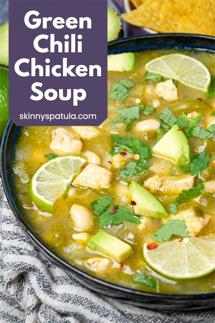 green chili chicken soup in a bowl with limes and cilantro