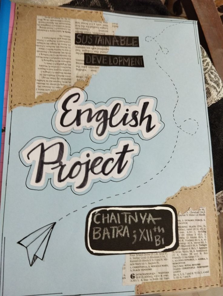 an english project book with paper cut outs