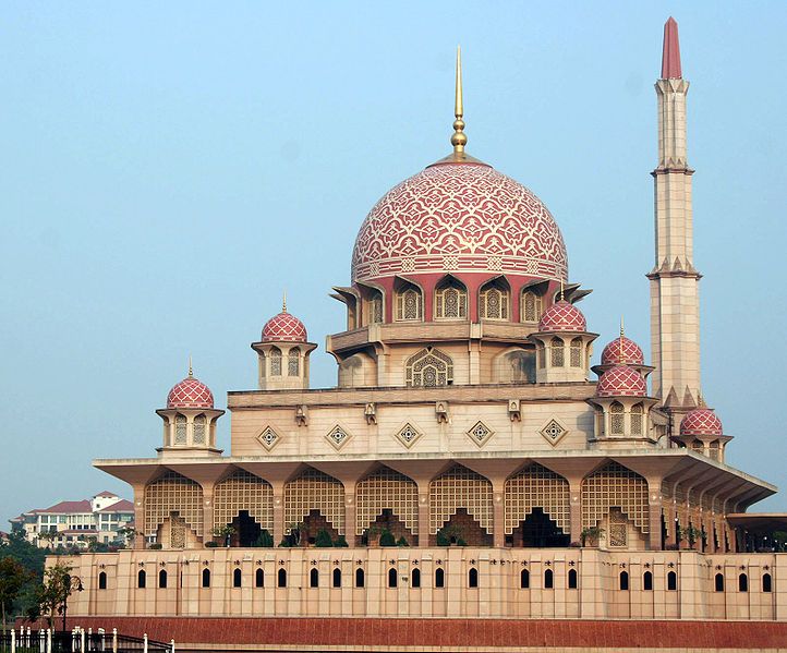 a large building with a red and white dome