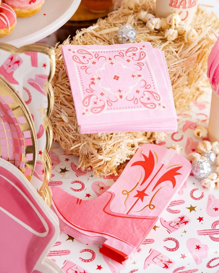 pink napkins and plates on a table