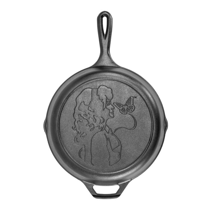 a frying pan with an image of a woman and a butterfly on the side