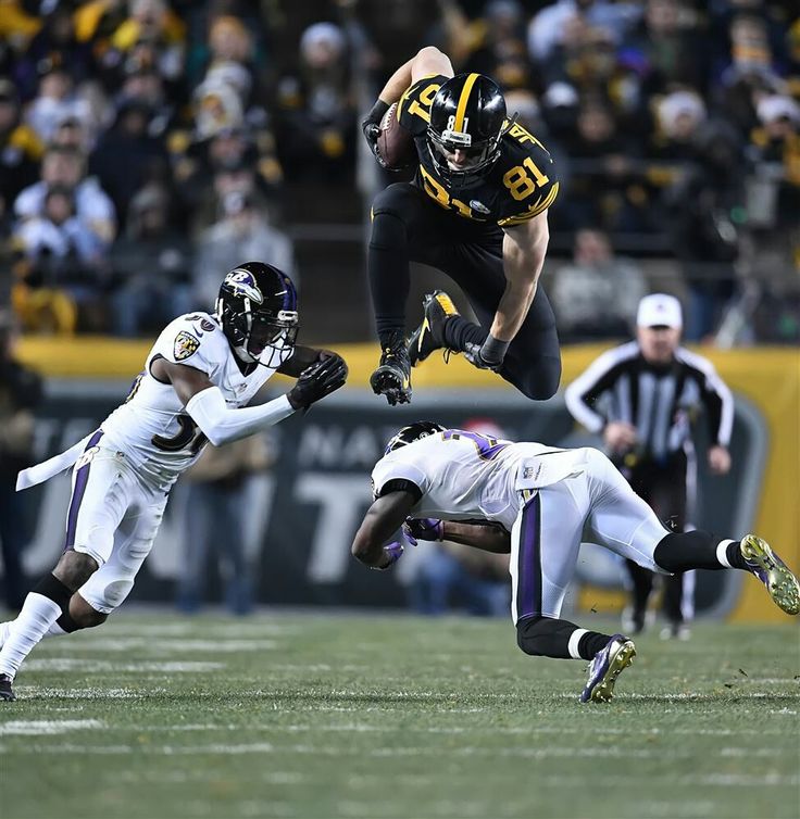 a football player is jumping in the air