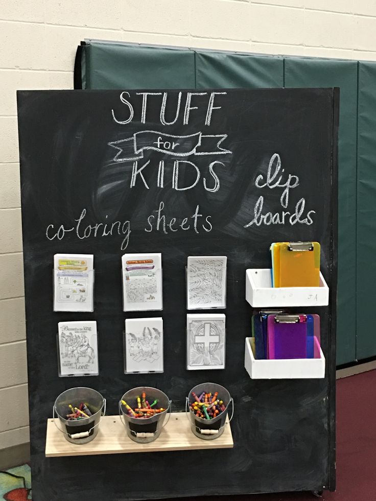 a blackboard with writing on it that says stuff for kids coloring sheets and pencils