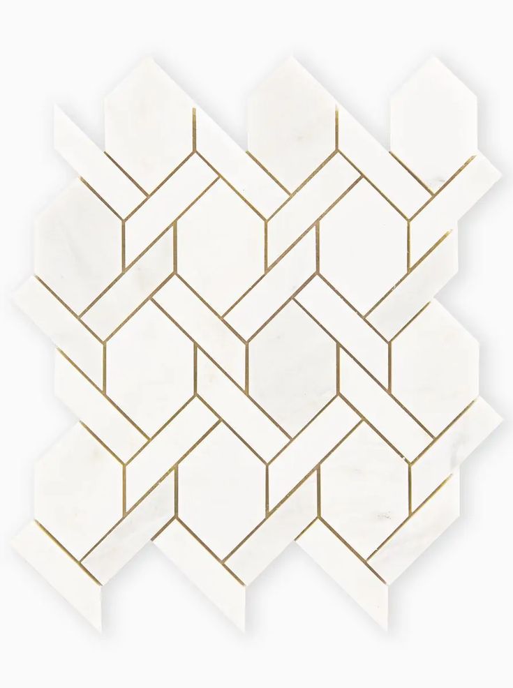 white and gold hexagonal tiles with golden lines on the top, in an angled pattern