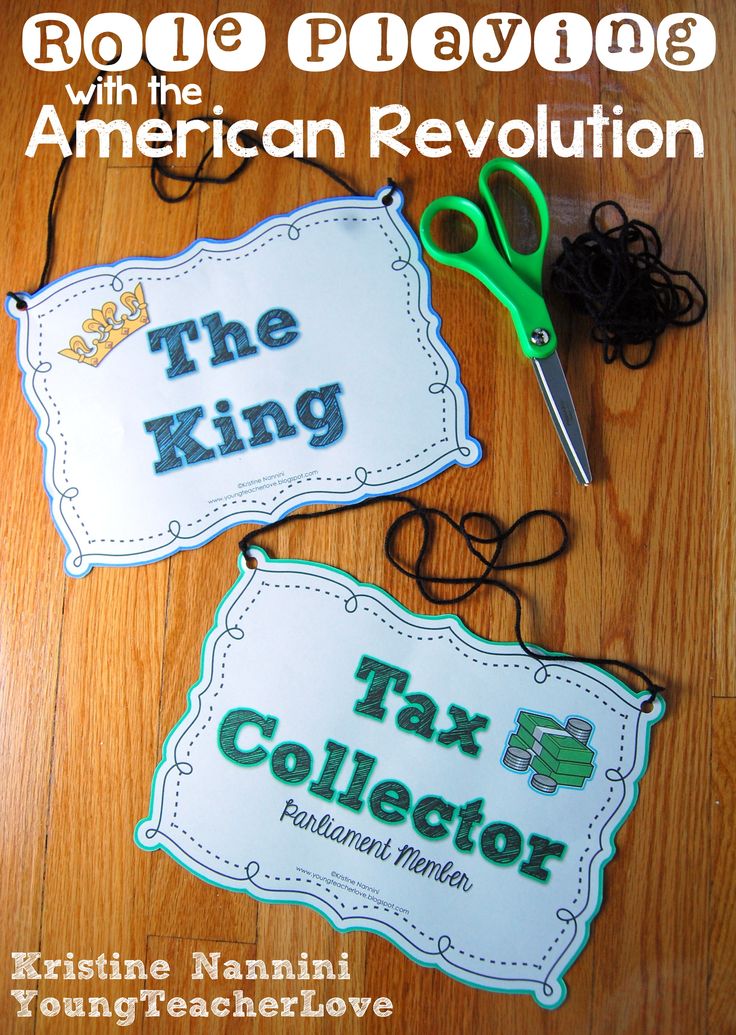 two signs that say the king and the tax collector on wood flooring with scissors