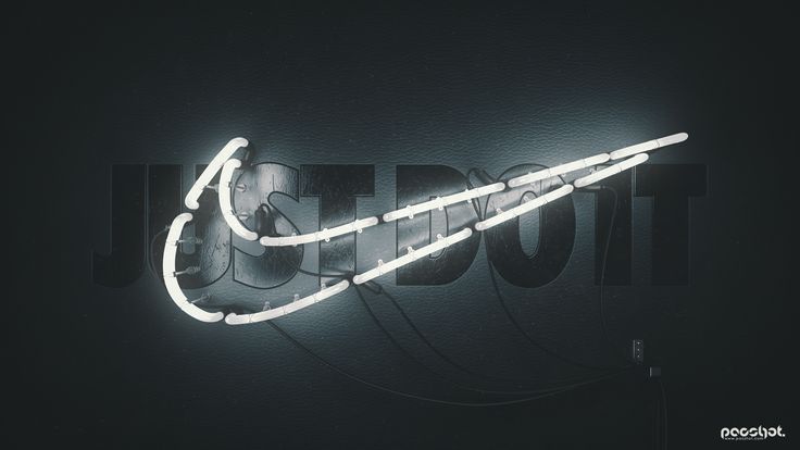 a nike neon sign hanging from the side of a wall