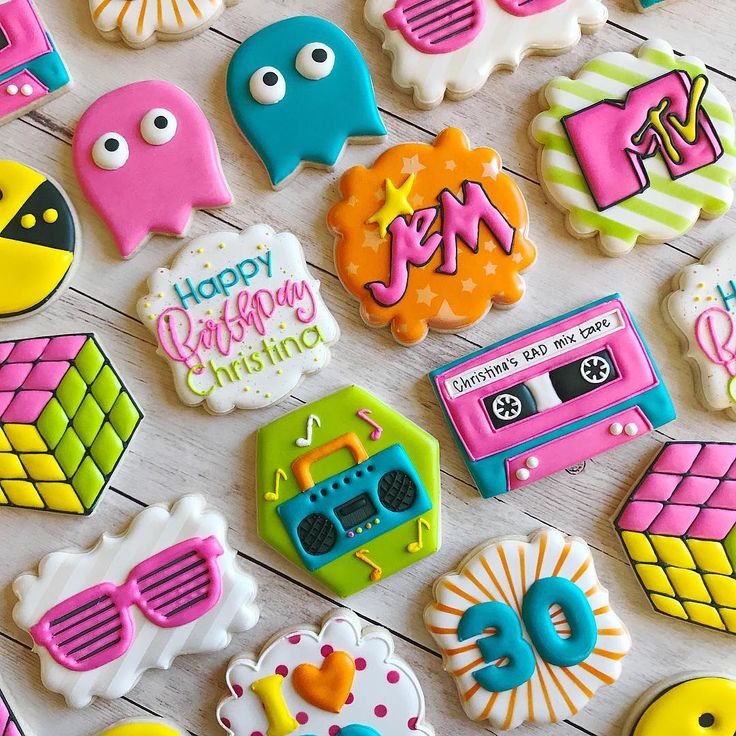 decorated cookies are arranged on a table