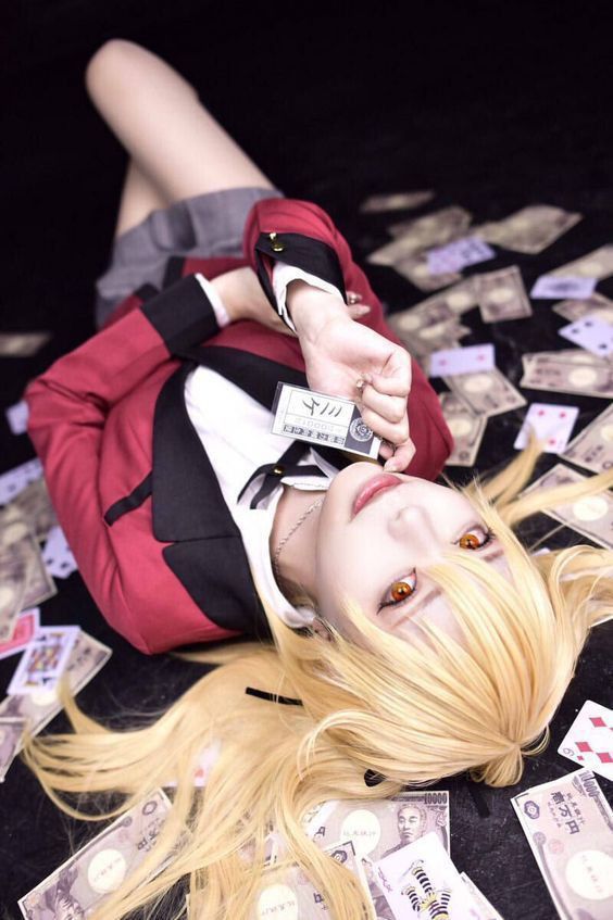 a woman laying on the ground surrounded by money