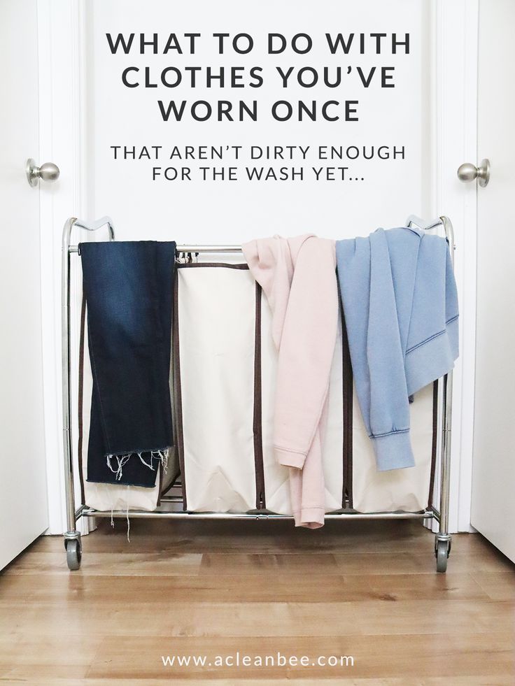 an ironing board with clothes hanging on it and the words what to do with clothes you've worn once that aren't dirty enough for the wash yet