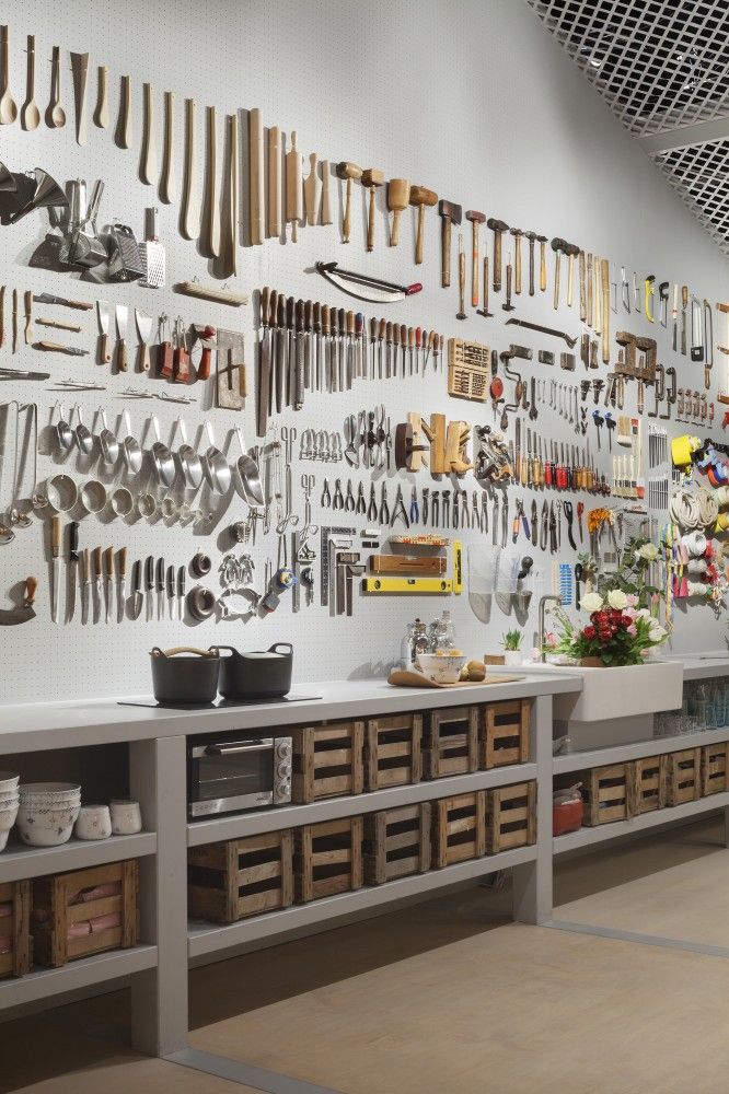 a room filled with lots of wooden utensils