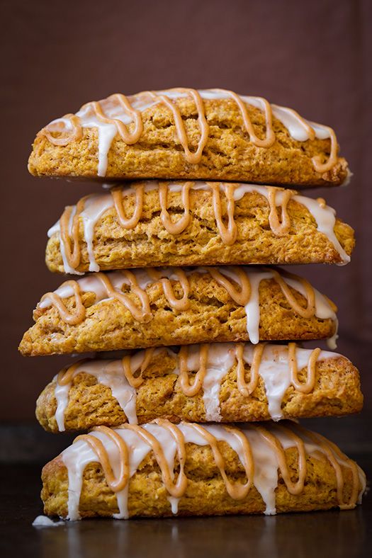 a stack of cookies with icing on top