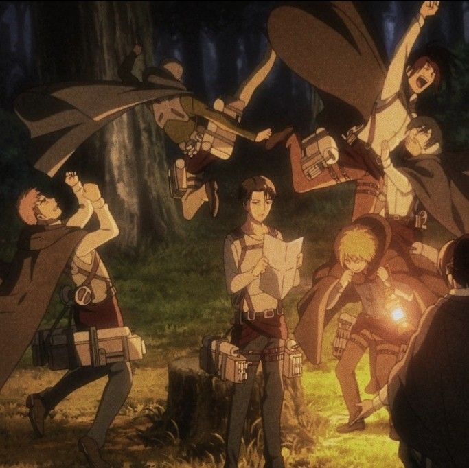 an anime scene with many people in the woods and one person holding something up to his head