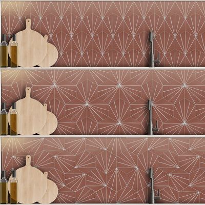 three wooden cutting boards sitting next to each other in front of a wall with geometric designs