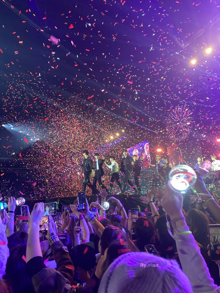 confetti is thrown in the air at a concert