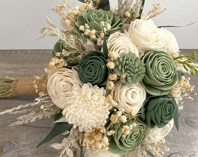 a bouquet of flowers sitting on top of a table