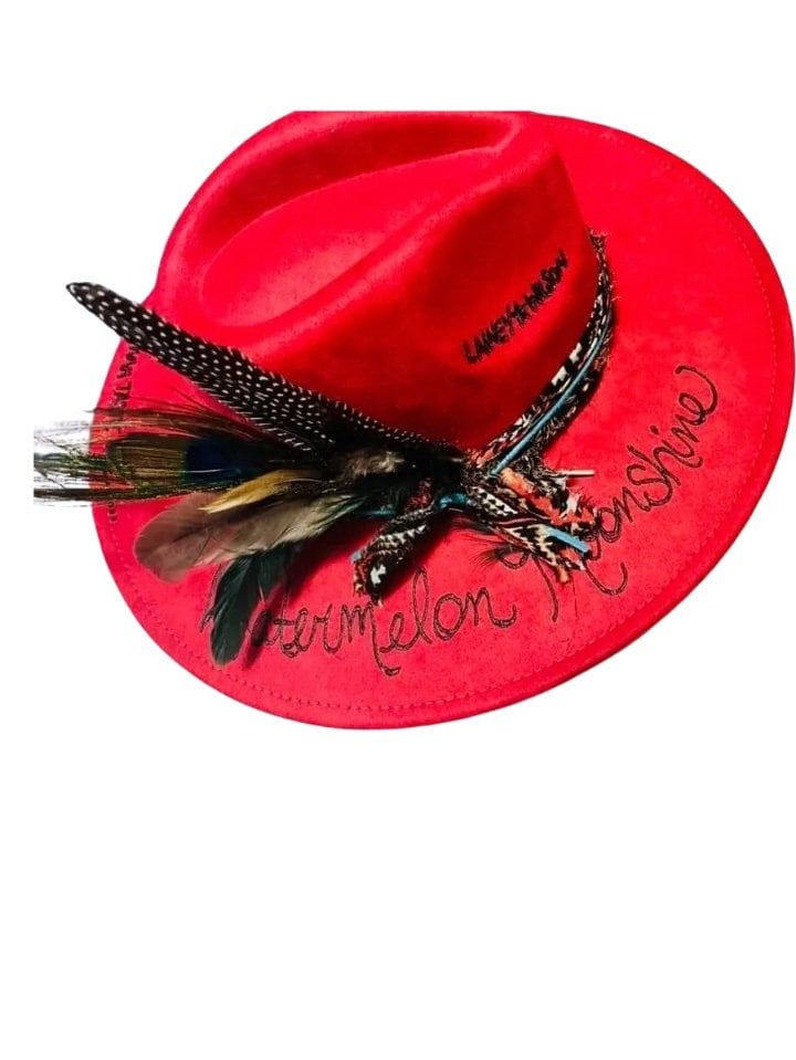 Introducing the Red Watermelon Moonshine Custom Rancher, a meticulously crafted hat that blends sophistication and style, perfect for the discerning professional seeking a touch of unique elegance. Black And Red Cowboy Hat, Red Western Fedora For Kentucky Derby, Bohemian Summer Felt Hat For Rodeo, Bohemian Felt Hat For Kentucky Derby Rodeo, Bohemian Felt Hat For Kentucky Derby And Western Events, Red Brimmed Costume Hat For Festival, Adjustable Red Felt Hat For Western-themed Events, Red Brimmed Festival Costume Hats And Headpieces, Red Brimmed Costume Hats And Headpieces For Festivals