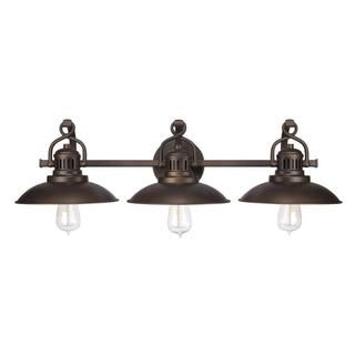 three light bathroom fixture with an antique brass finish