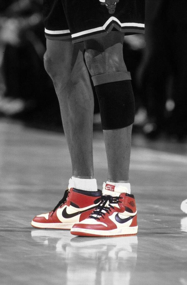 black and white photograph of a basketball player's shoes