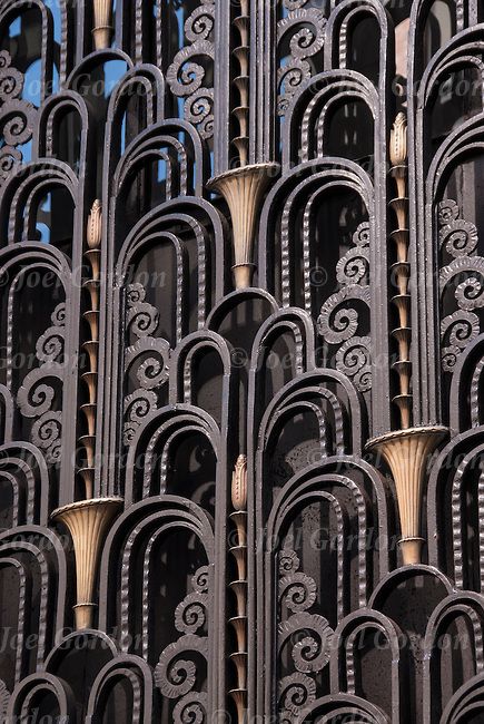 an intricately designed building is shown against the blue sky