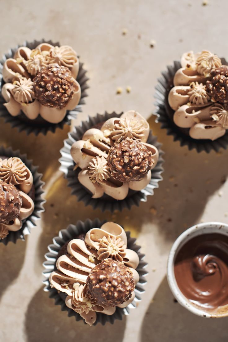 several cupcakes with chocolate frosting and sprinkles on them are shown from above