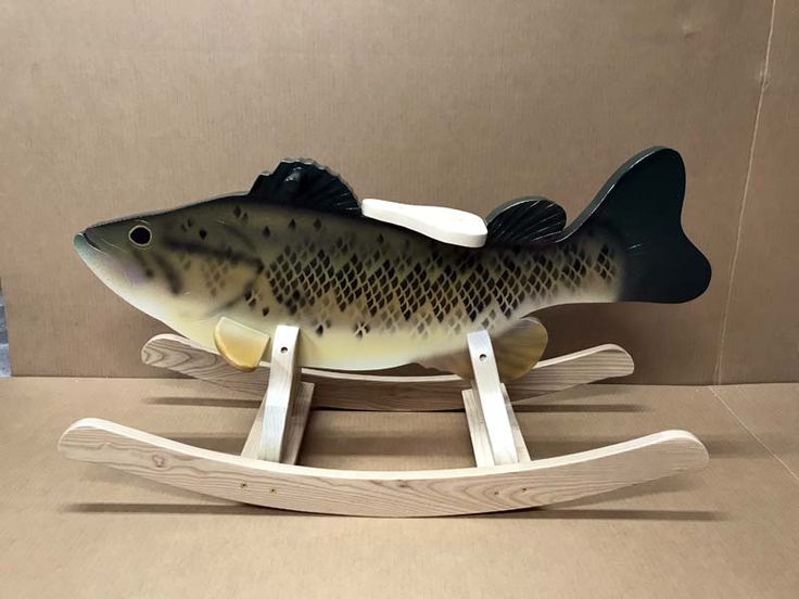 a fish is sitting on a wooden stand