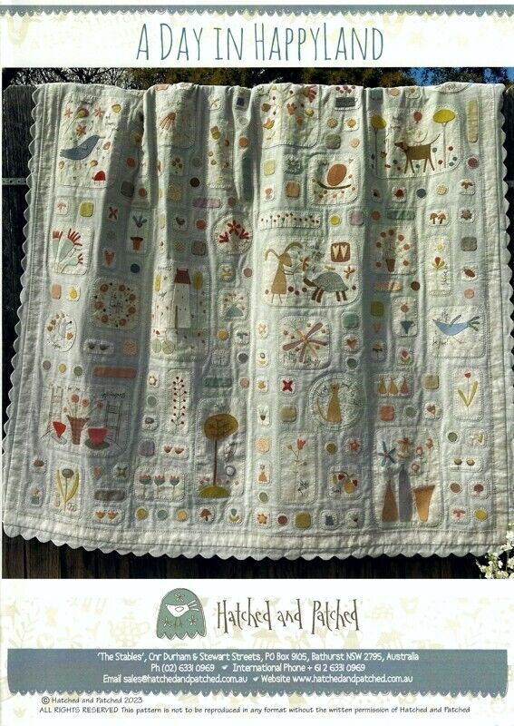 a quilted blanket with animals on it and the words, a day in happland