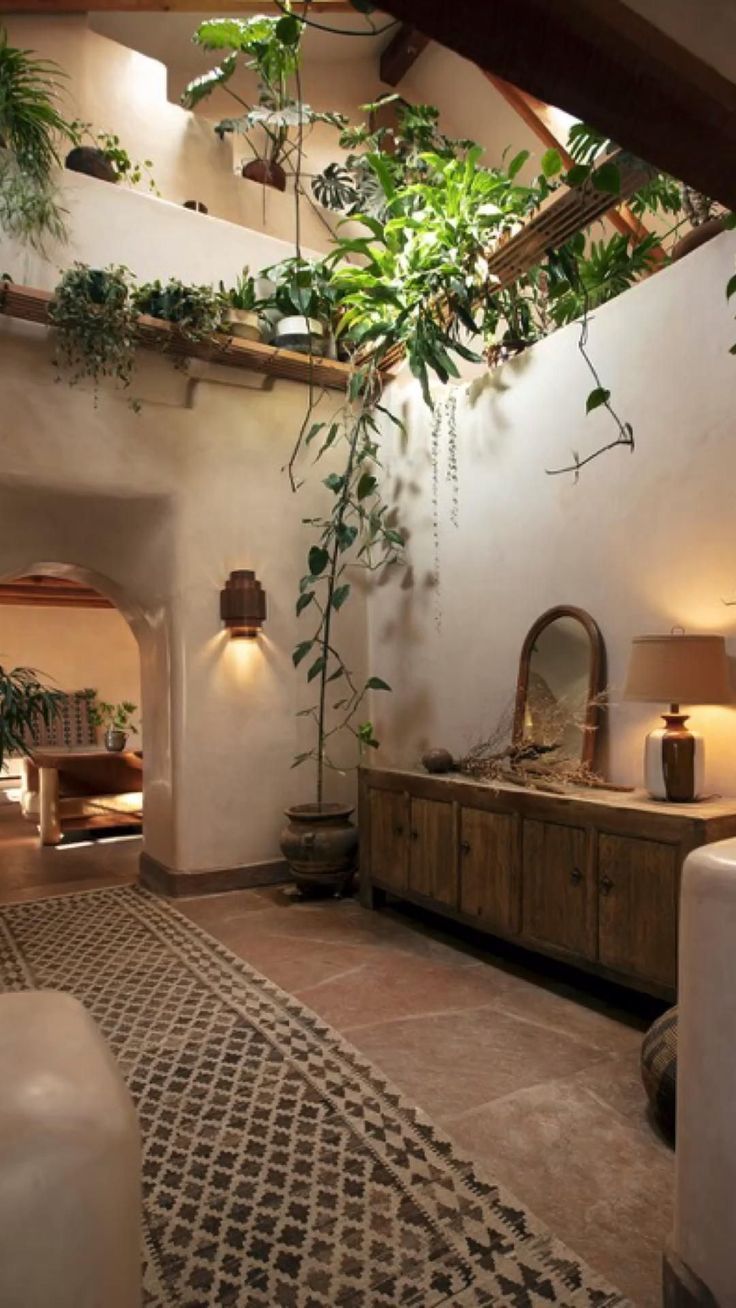 an indoor living room with plants on the wall