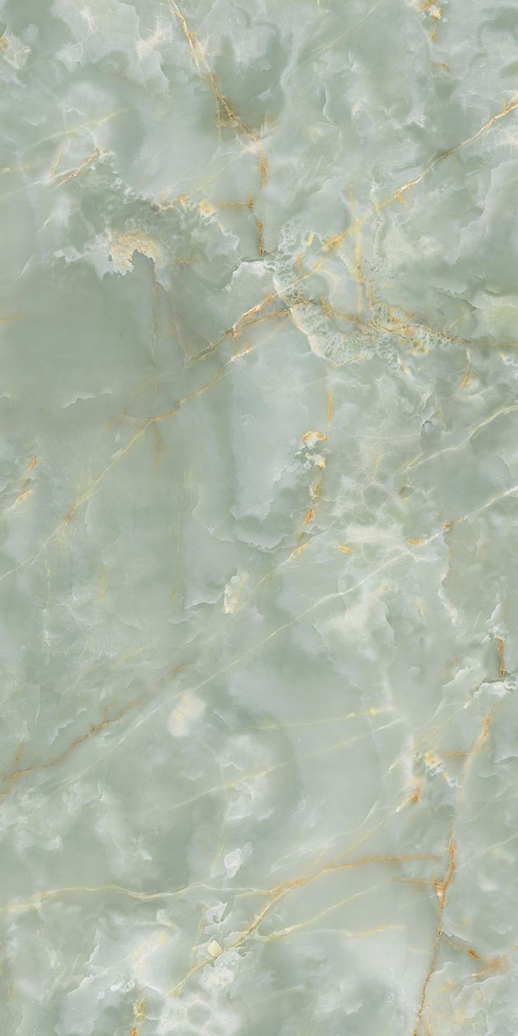 an abstract marble background with gold veining and white paint on the top half of it