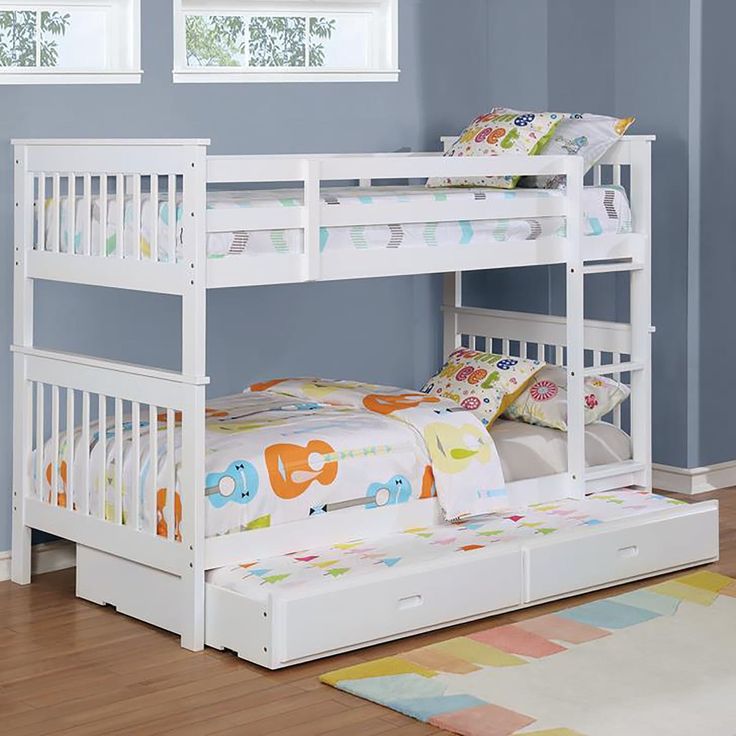 a white bunk bed with drawers underneath it in a child's room or bedroom