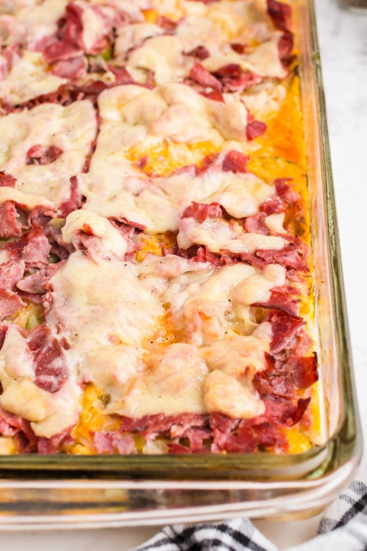 a casserole dish with meat and cheese on top