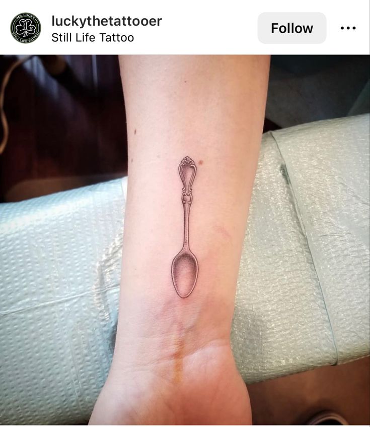 a small spoon tattoo on the ankle