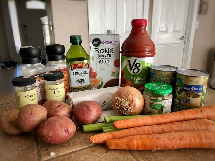 carrots, potatoes and other ingredients on a kitchen counter