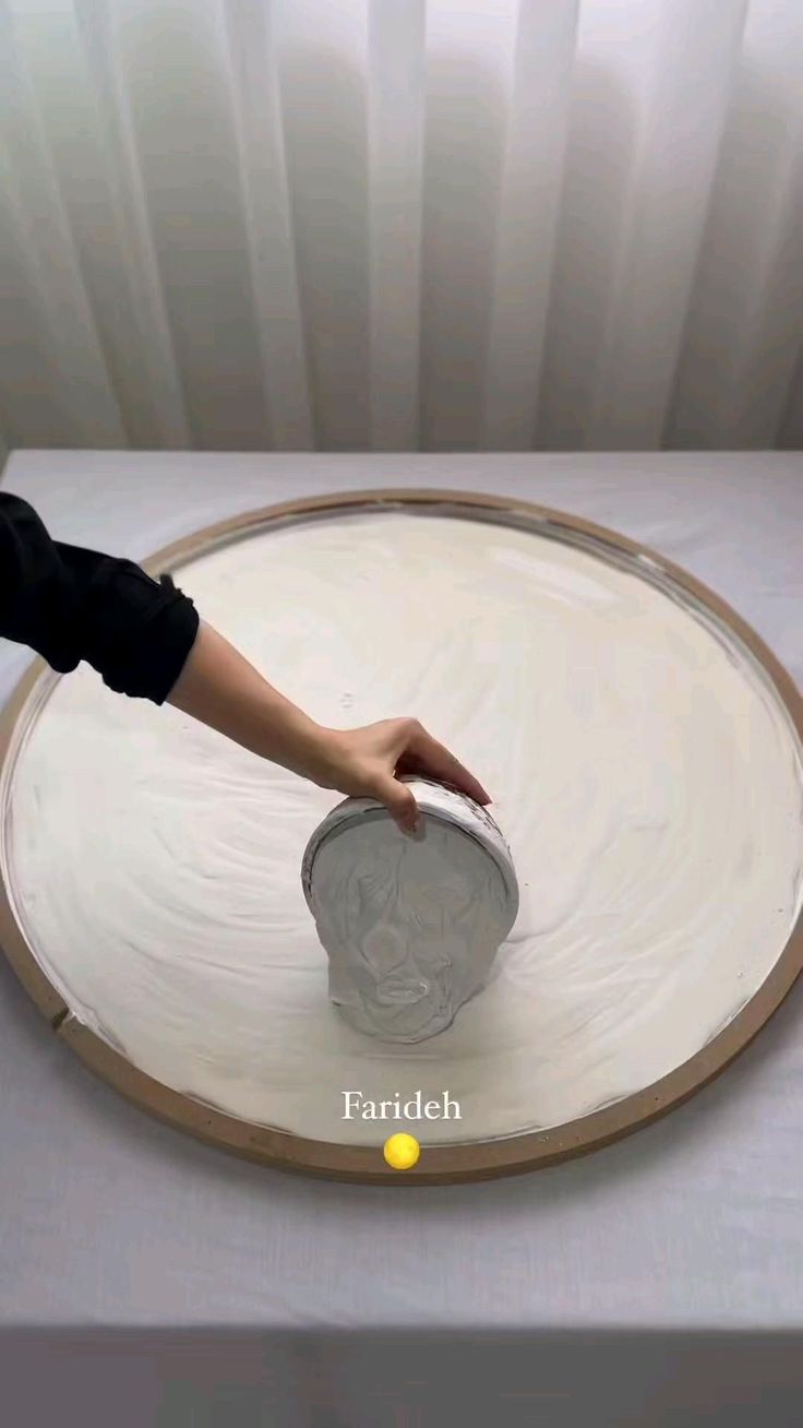 a person reaching for a can on top of a table