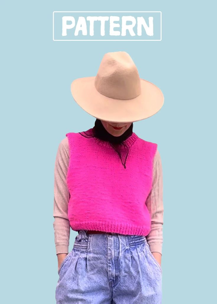 a woman wearing a pink sweater and blue shorts with a hat on top of her head