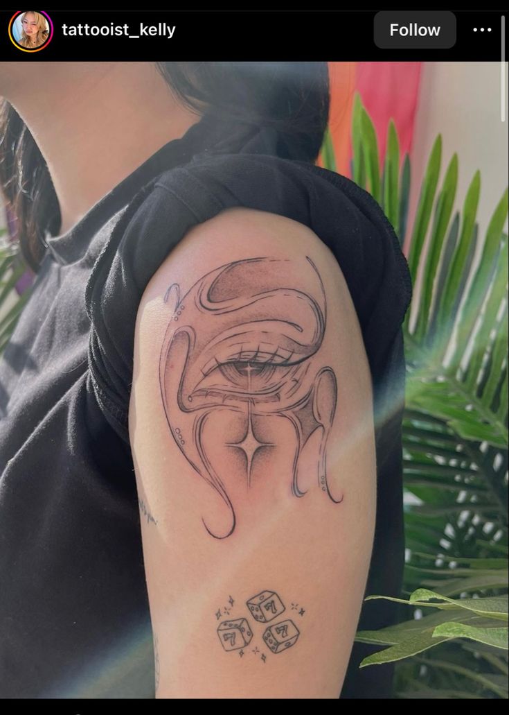 a woman's arm with an octopus tattoo on the left side of her arm