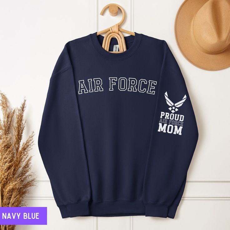 Elevate your style and showcase your pride as a dedicated Air Force mom with our 'Proud Air Force Mom' sweatshirt. Crafted with comfort and designed to honor the sacrifices and achievements of Air Force families, this sweatshirt is the perfect addition to your wardrobe. Featuring bold 'Air Force' lettering on the front and the heartfelt phrase 'Proud Air Force Mom' on the sleeve, this sweatshirt is a powerful symbol of your unwavering support for your loved one in the Air Force. Whether you're c Air Force Mom Shirt, Air Force Sweatshirt, Air Force Graduation, Air Force Family, Air Force Families, Air Force Mom, Basic Training, Military Mom, Mom Sweater