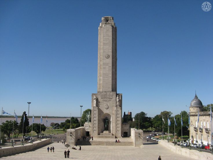 a large monument with people walking around it