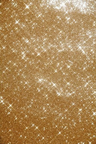 gold glitter texture background with white stars and sparkles on the edges, like snow flakes