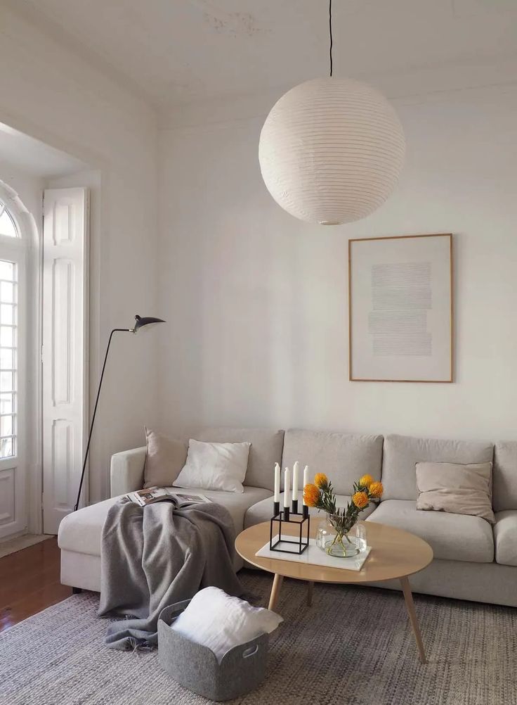 a living room with white walls and furniture