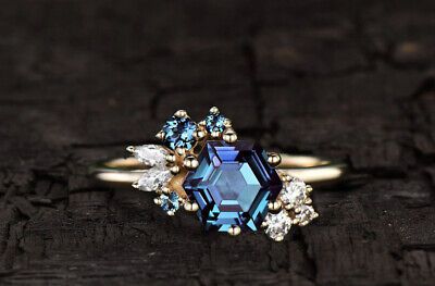 an engagement ring with blue and white stones