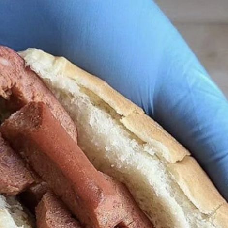 a close up of a hot dog in a bun