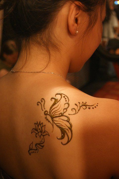 a woman with a tattoo on her back