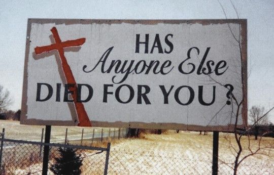 a sign that says, has anyone else died for you? with a cross on it