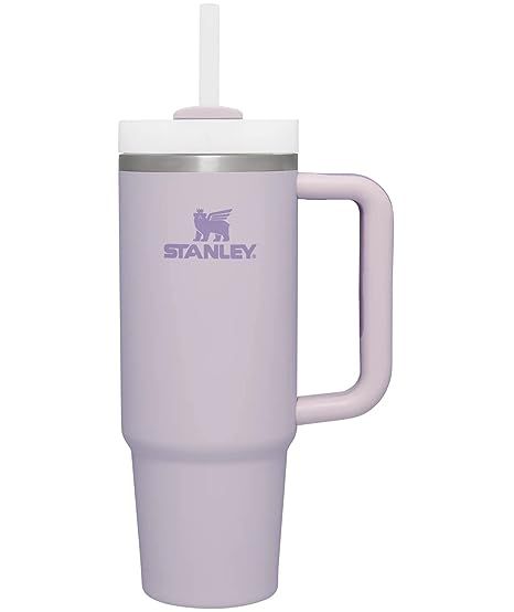 the tumbler cup is purple and has a straw in it's mouth,