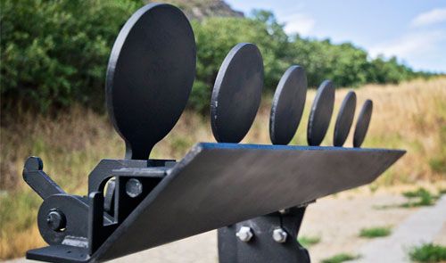 a metal sculpture with multiple spoons and forks sticking out of it's sides