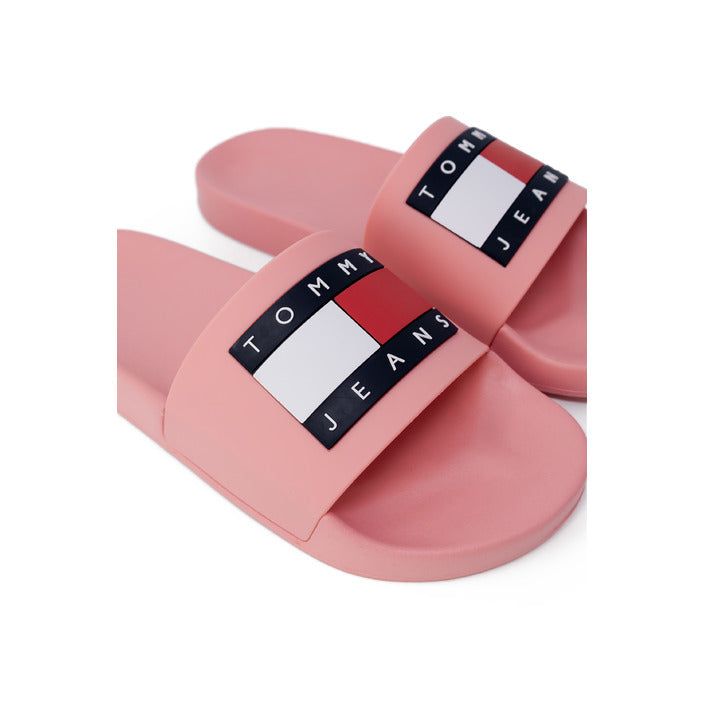 Brand: Tommy Hilfiger Jeans Gender: Women Type: Slippers Season: Spring/Summer PRODUCT DETAIL • Color: pink • Pattern: print • Fastening: slip on • Sole: rubber • Size (cm): 2 COMPOSITION AND MATERIAL • Composition: -100% polyurethane Trendy Pink Flip Flops For Summer, Pink Summer Slip-on Slides, Trendy Pink Slide Sandals, Trendy Pink Flip Flops For Vacation, Pink Non-slip Slides For Spring, Comfortable Pink Open Toe Slides, Pink Slide Flip Flops For Summer, Pink Open Toe Slides For Summer, Pink Slip-on Slides For Spring