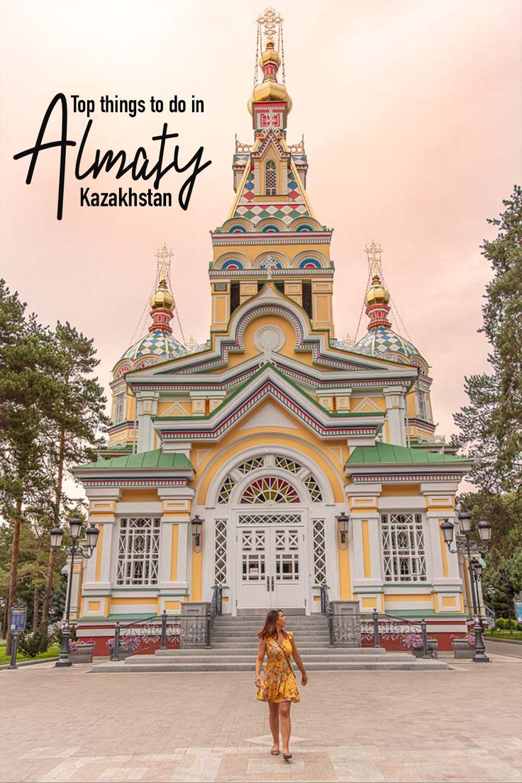 a woman standing in front of a yellow and white building with the words, a two week kazbastan krygystan