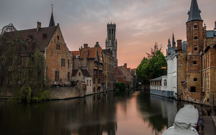 a river running through a city next to tall buildings