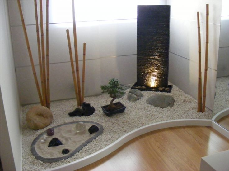 a room with some rocks and plants in it